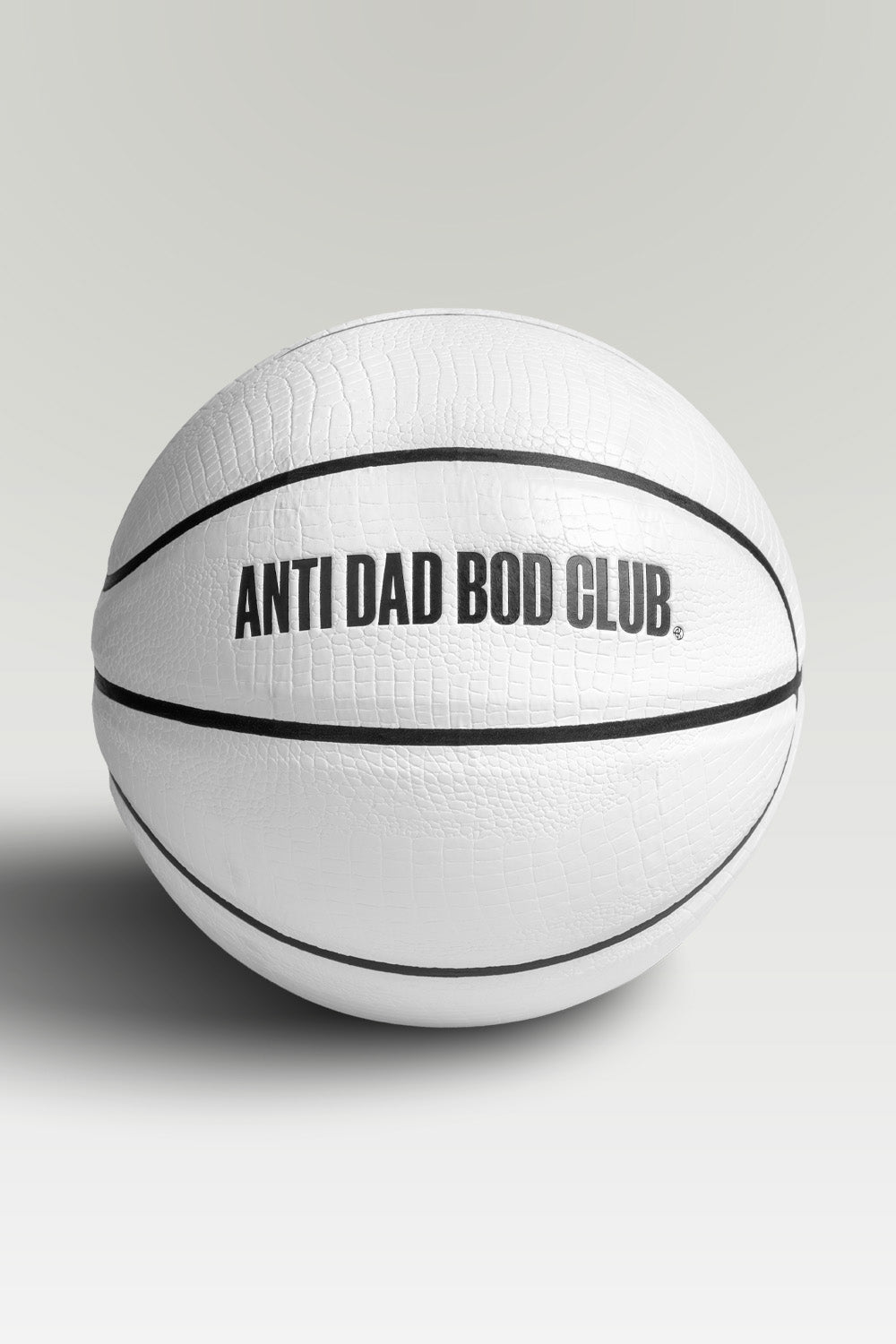 White textured basket ball with 'Anti Dad Bod Club' text on a light gray background