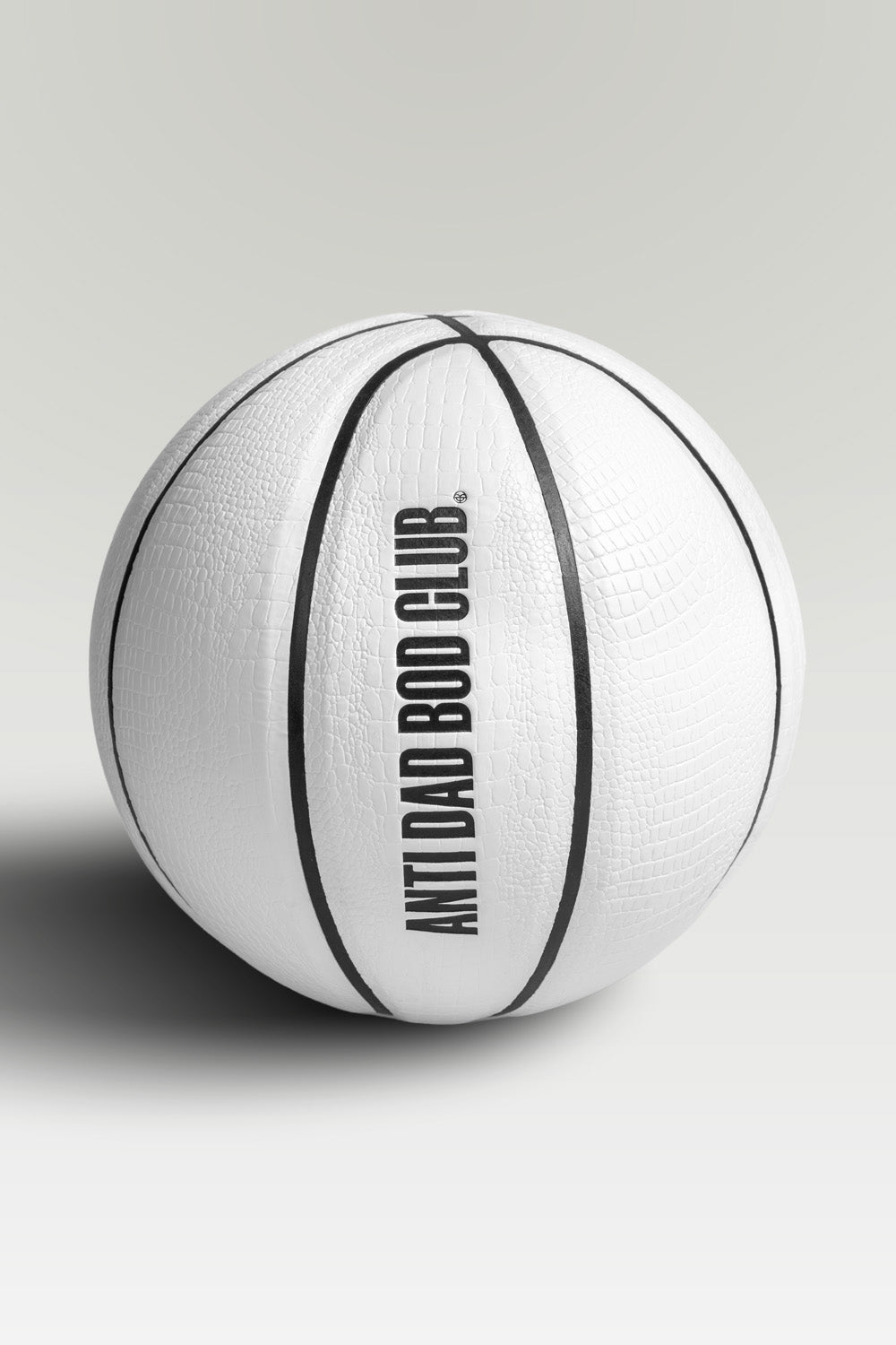 White textured basket ball with 'Anti Dad Bod Club' text on a light gray background