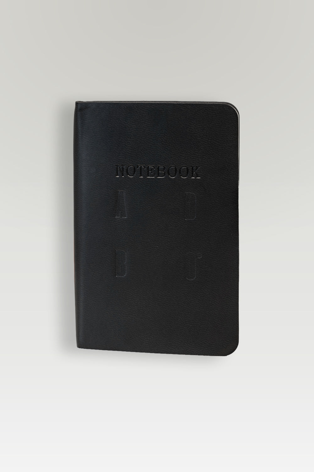 Black notebook with 'Notebook' embossed on a white background