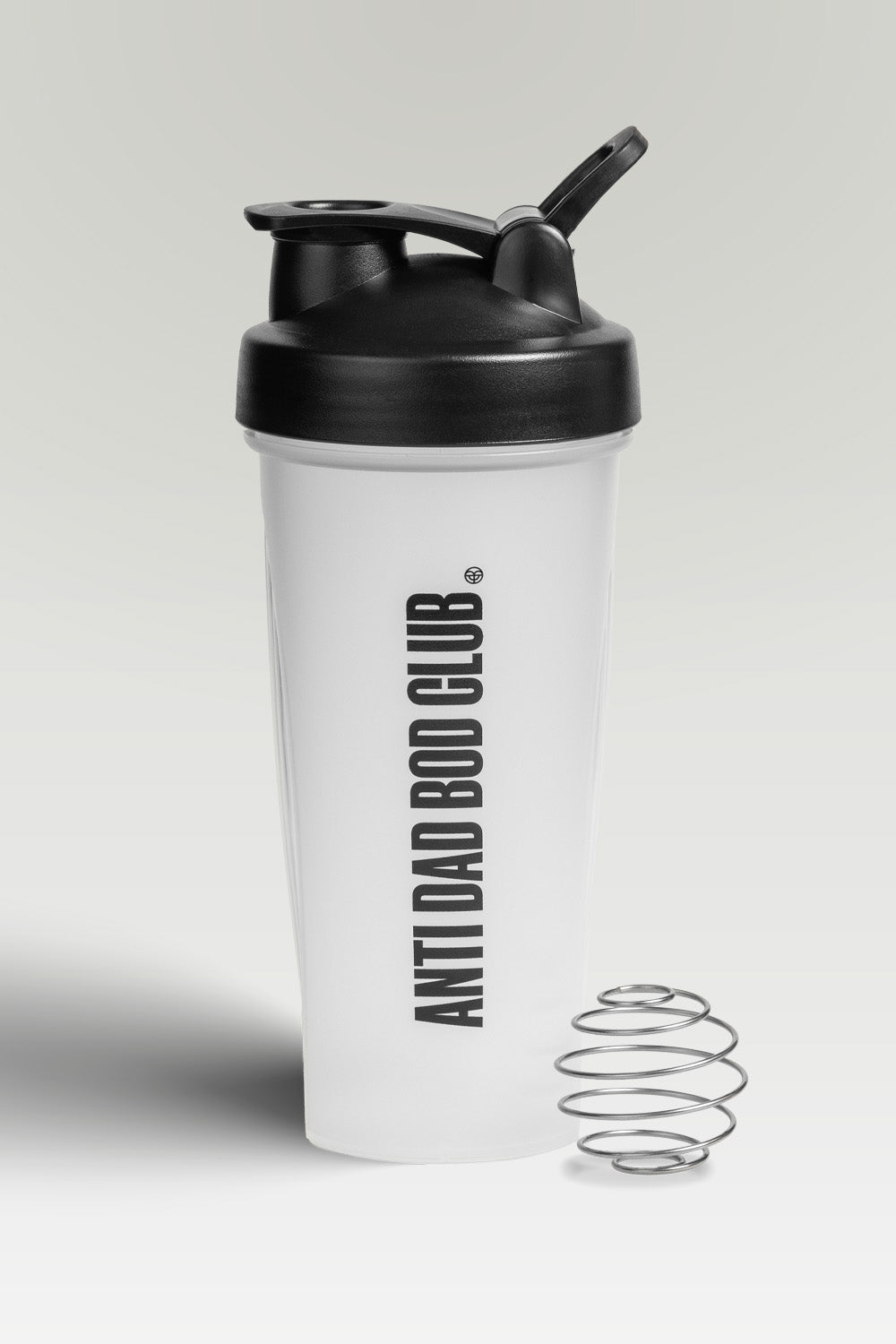 Semi transparent shaker bottle with black lid and 'Anti Bad Bod Club' text on a light gray background