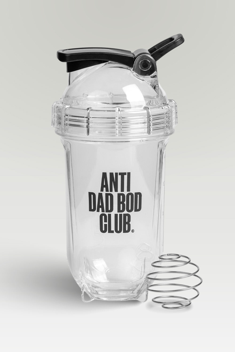 Clear protein shaker bottle with 'Anti Dad Bod Club' text on a light gray background