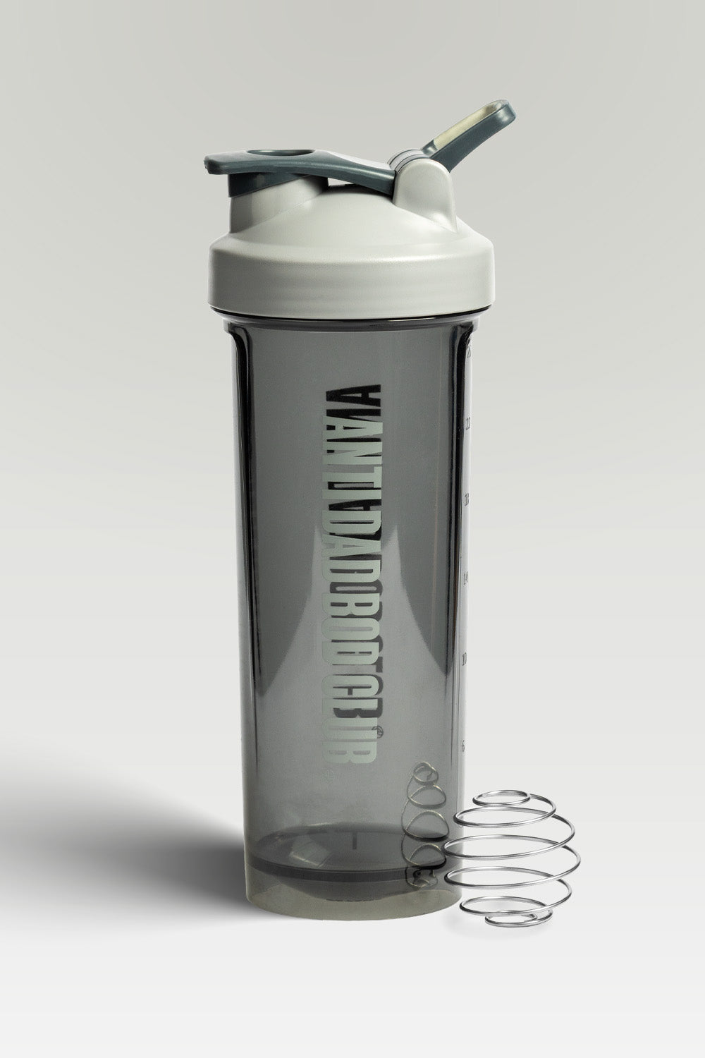 Gray shaker bottle with a white cap and black text on a light gray background