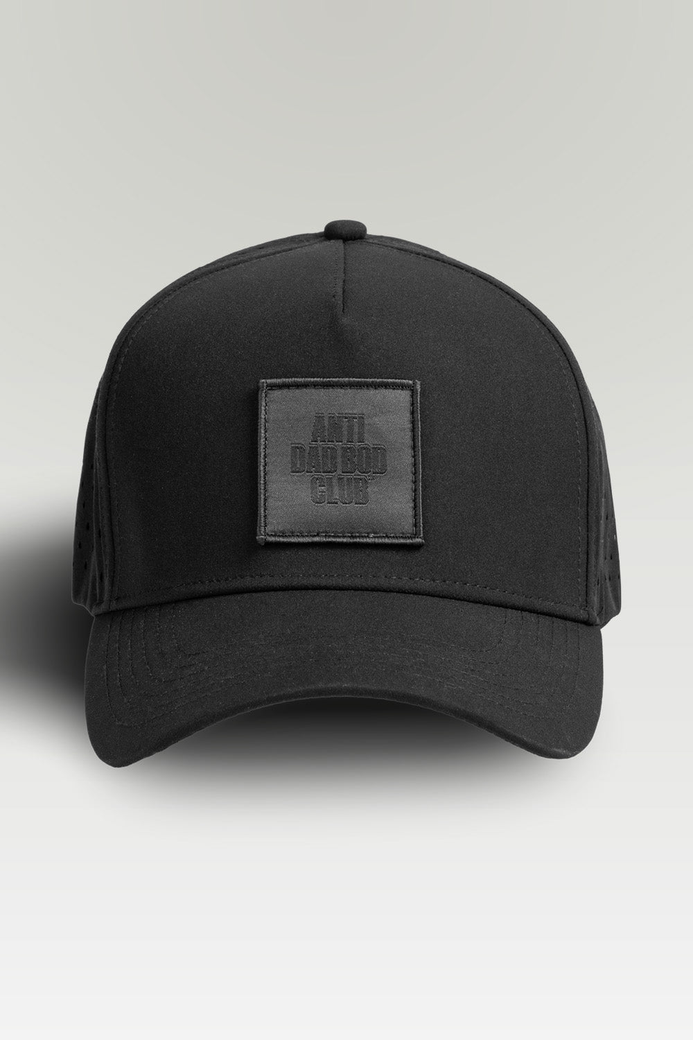 Black cap with a patch on a light gray background