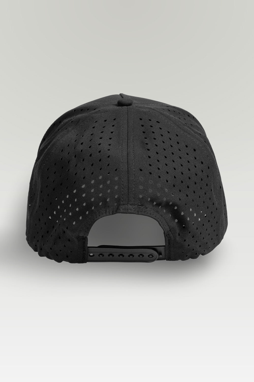 Black baseball cap with perforated design on a white background